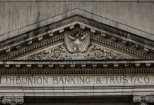 brown concrete building with statue