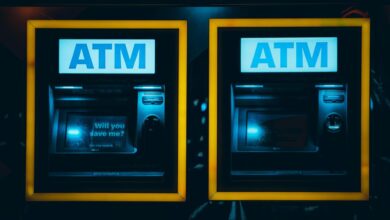 a couple of atm machines sitting next to each other