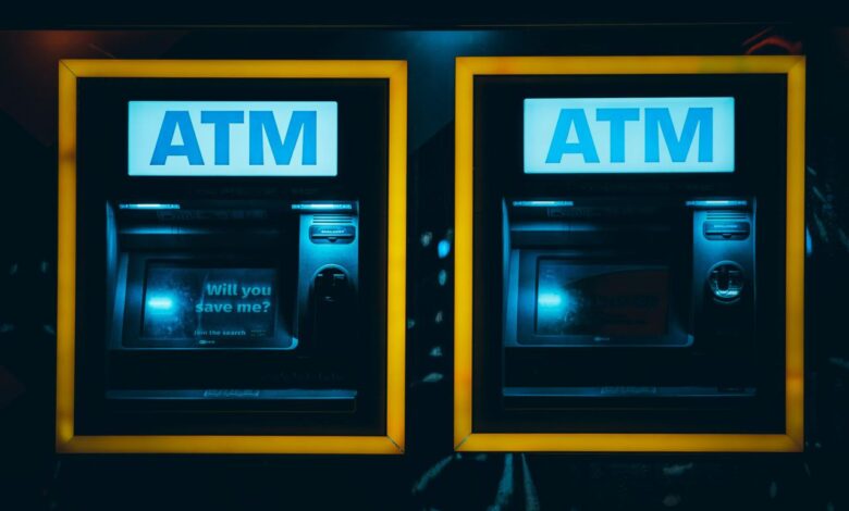 a couple of atm machines sitting next to each other
