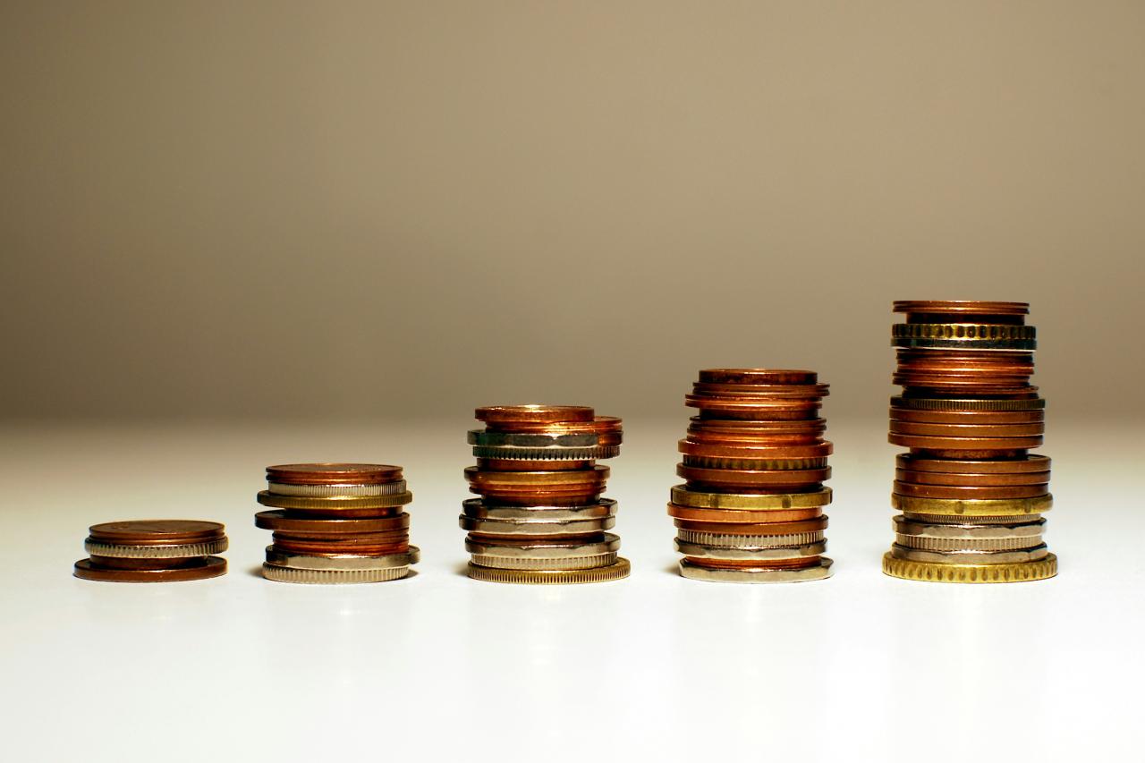 Stacks of coins increasing in height from left to right.