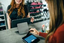 woman holding magnetic card